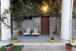 Heritage room entrance with plants and seating at Royal Heritage Nainital