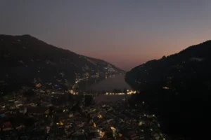 Night view of Nainital Lake with illuminated town and hills